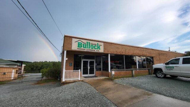 Front entrance to Bullock Lumber Co. in a red brick building