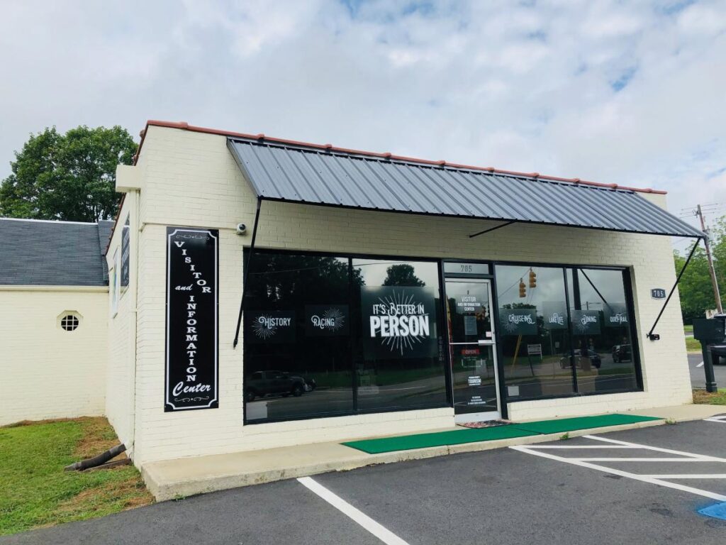 The front of Person County Tourism visitor center in a white brick building